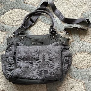 Petunia Pickle Bottom fabric diaper bag, over the shoulder.
